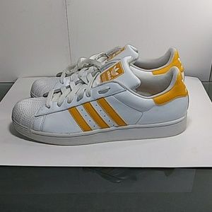 Men's size 13 yellow and white Adidas shell tops